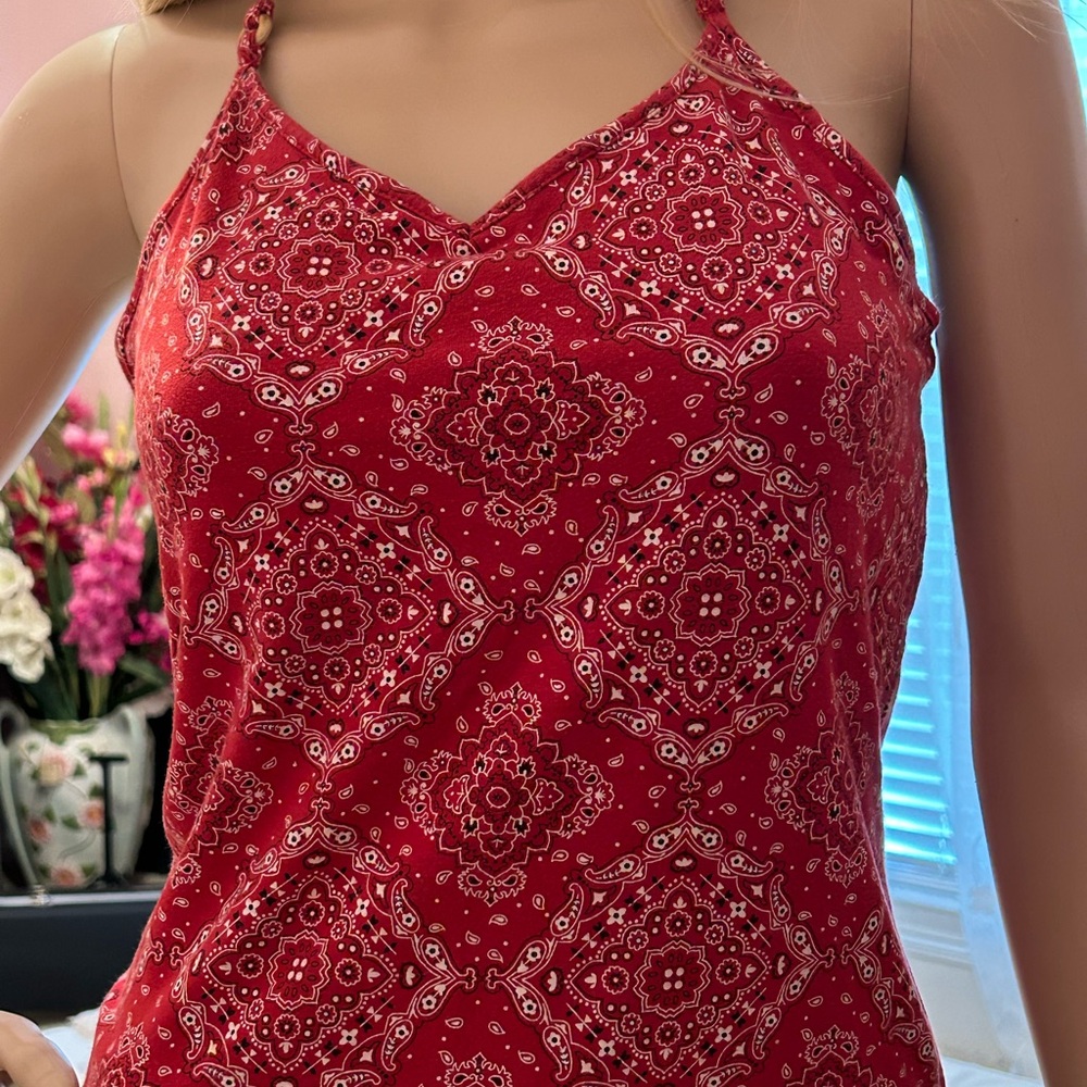 Handkerchief print, halter top with shelf bra. Wood bead detailing on straps.